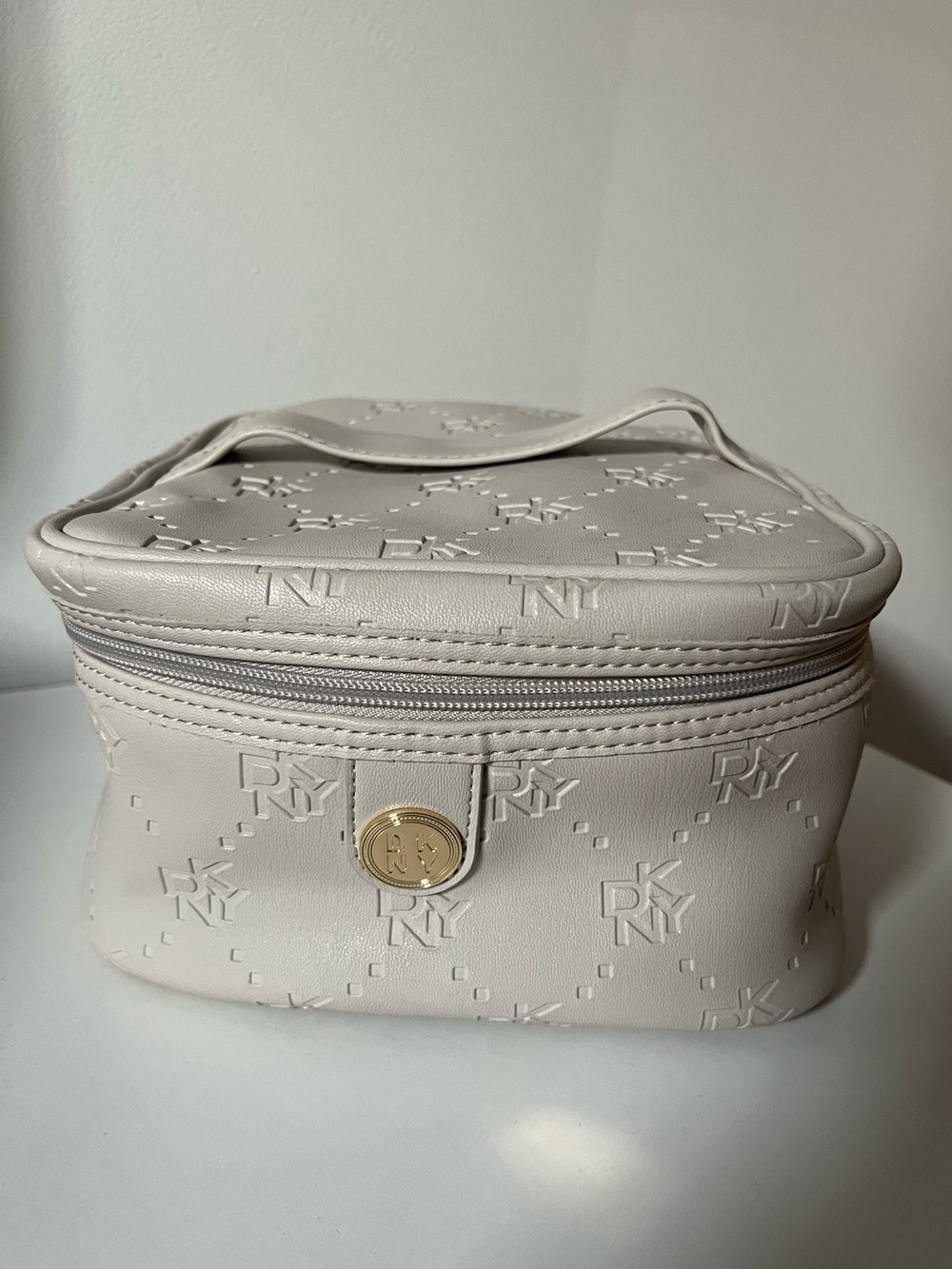DKNY Cream Embossed Logo Cosmetic Case with Gold-Tone Accent